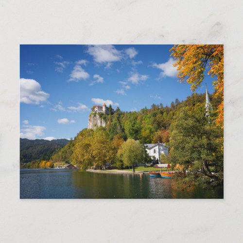 Lake Bled with trees in autumn colors in Slovenia Postcard