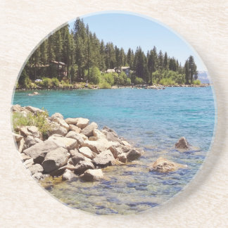 Lake Tahoe's clear waters with snowy mountains Sandstone Coaster