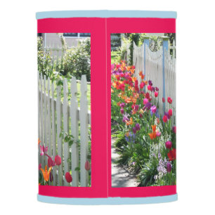 lampshade with tulips along white picket fence