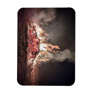Large bonfire burning at night with high flames magnet