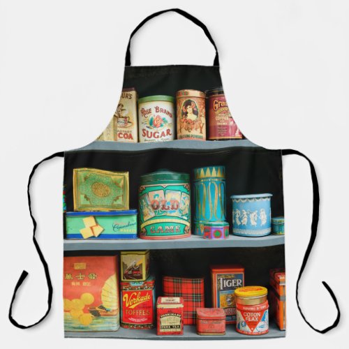 Large collection of colorful vintage cans displaye apron
