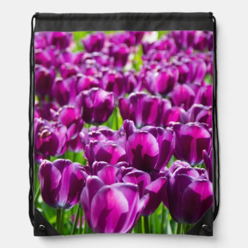 Large field of purple tulips   drawstring bag