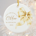 Last Christmas as a Miss - Gold Ribbon Ceramic Ornament<br><div class="desc">Celebrate your final Christmas as a Miss with this elegant, minimalistic ornament. Featuring a luxurious gold bow and sophisticated fonts, this ornament is perfect for brides-to-be as they prepare for their next chapter. Hang it proudly on your tree as a beautiful reminder of your engagement season and the magical moments...</div>