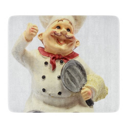 Laughing chef with pan pottery figurine cutting board