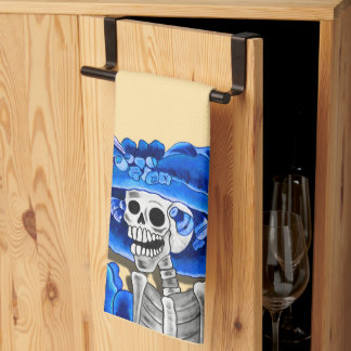 Laughing Skeleton Woman in Blue Kitchen Towel