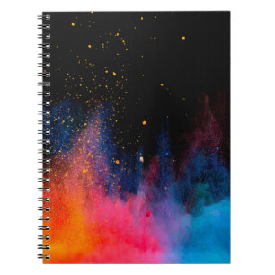 Launched colorful powder, isolated on black backgr notebook