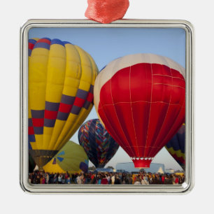 Launching hot air balloons metal ornament
