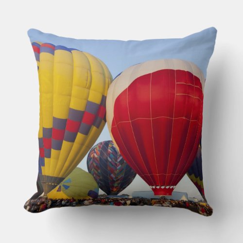 Launching hot air balloons throw pillow