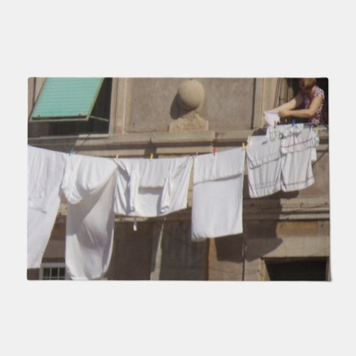 Laundry on clothesline from balcony Door Mat