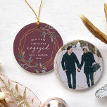 Laurel Leaf First Engaged Christmas Ceramic Ornament<br><div class="desc">Celebrate your first Christmas as an engaged couple with this charming and festive ornament. Round design features "our first Christmas engaged" in modern block and script lettering, surrounded by a faux gold foil border accented with green winter leaves. Personalize with your names and the year, and add a photo to...</div>