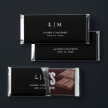 Lauren Black Monogram Elegant Wedding Hershey Bar Favors<br><div class="desc">Simple personalized Hershey's Bar Wedding Favors featuring a modern yet elegant design with your two letter monogram along with your names and date in white over a black background. The back has your personalized message. The font and background colors may be changed to any colors you wish by clicking the...</div>