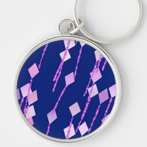 lavender and pink kites against dark blue keychain