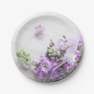 Lavender-colored flowers on old music paper plates