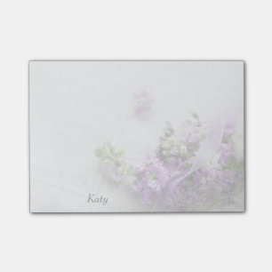 Lavender-colored flowers on old music post-it notes