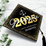 Law School Class of 2025 Graduation Cap Topper<br><div class="desc">Celebrate your achievement with a flourish of style and dignity! Our law student graduation cap topper spells out excellence with its eye-catching black background, glistening gold border, and prominent depiction of the scales of justice. Customization has never been easier - adjust the color to your preference, personalize the modern text...</div>