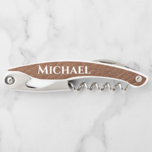 Leather texture with name in white waiter's corkscrew