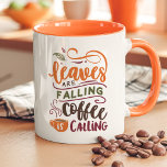 Leaves Are Falling Coffee Is Calling Cute Fall Mug<br><div class="desc">Embrace the cozy vibes of autumn with this cute fall mug featuring the playful phrase, "Leaves Are Falling, Coffee Is Calling." Perfect for coffee lovers who adore the fall season, this mug brings warmth and charm to every sip. With autumn colors and a charming design, it’s an ideal choice for...</div>