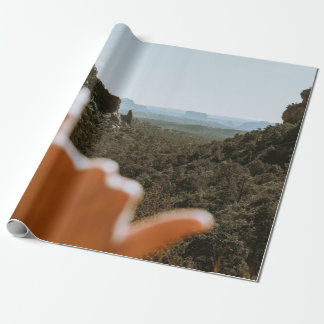 Left human hand wrapping paper