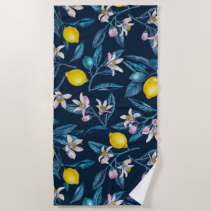 Lemon branches with blossoms and fruit on blue beach towel