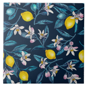 Lemon branches with blossoms and fruit on blue ceramic tile