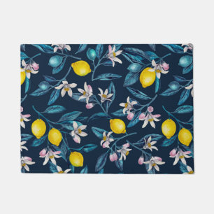 Lemon branches with blossoms and fruit on blue doormat