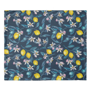 Lemon branches with blossoms and fruit on blue duvet cover