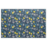 Lemon branches with blossoms and fruit on blue fabric