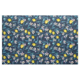 Lemon branches with blossoms and fruit on blue fabric