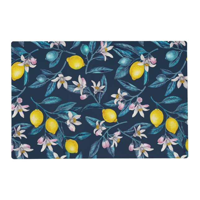 Lemon branches with blossoms and fruit on blue placemat (Front)