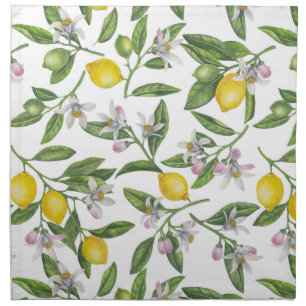 Lemon branches with blossoms and fruit on white cloth napkin