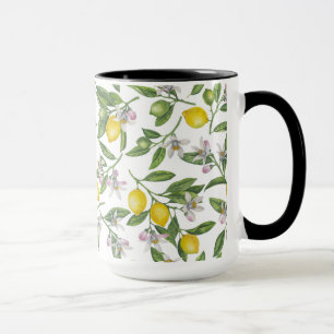 Lemon branches with blossoms and fruit on white mug