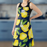 Lemon Monogram Citrus Navy Blue Apron<br><div class="desc">Introducing the Lemon Monogram Citrus Apron, your ultimate companion in the kitchen. This isn't just an apron, it's a symbol of your passion for cooking, a mark of your style, an extension of your culinary personality. The vibrant lemon design isn't just eye-catching, it's an expression of a zest for life,...</div>