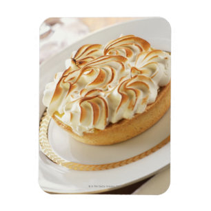 Lemon tart with baked meringue on plate magnet