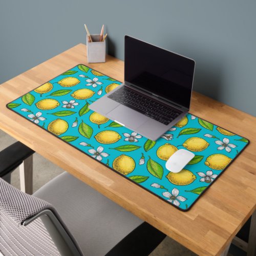 Lemons on blue desk mat