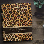 Leopard brown bronze pattern gold foil stripe name planner<br><div class="desc">Get Organized in Style with Our Leopard Brown Bronze Pattern Gold Foil Stripe Name Planner! Elevate your planning game with this chic and sophisticated planner. Featuring a stunning brown bronze leopard skin pattern, a luxurious gold foil stripe, and the option to personalize with your name in elegant gold script typography....</div>