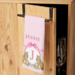 Leopard Christmas Crest Monogram With Name Kitchen Towel<br><div class="desc">This kitchen towel has a preppy grandmillennial crest design featuring a leopard wearing a wreath with a monogram letter in the center on a pink background. You can personalize with  your initial and name</div>