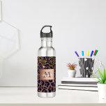 Leopard pattern brown black golden bronze monogram stainless steel water bottle<br><div class="desc">Elegant,  glamorous and feminine with brown,  golden and black leopard pattern,  decorated with golden confetti. Template for your name. A faux bronze  colored label. Add your name and monogram letter,  black and white text.</div>