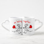 Lesbian Couple's We Belong Together Gift Coffee Mug Set<br><div class="desc">Celebrate the beauty of love with this cute lesbian couple's mug set, designed to honor meaningful relationships with warmth and whimsy. Featuring two joyful stick-figure women holding hands and red heart balloons, the design is brought to life with playful hand-drawn elements and vibrant red accents. The heartfelt message “we belong...</div>