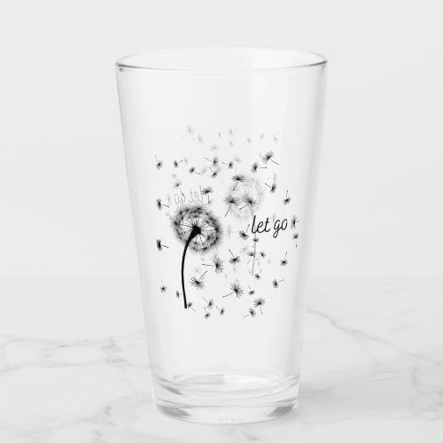 Let go dandelion seed flowing in the wind  glass