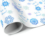 Let It Snow- White Wrapping Paper<br><div class="desc">Snowflakes in shades of blue dance over this festive wrapping paper.  Between the flakes are the words,  "Let It Snow!".  Also available in other colors.</div>