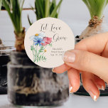 Let Love Grow Wildflower Charm Bridal Shower Classic Round Sticker<br><div class="desc">Let love grow bridal shower label ready for you to personalize. The design has rustic country wildflowers in watercolor, including poppy daisy and cornflower. It is hand lettered in bouncy calligraphy with Let love grow and the template is set up for you to customize. A trendy cottagecore design perfect for...</div>