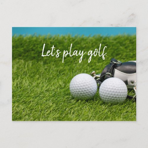 Lets play golf with golf ball on green grass postcard