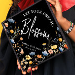 Let Your Dreams Blossom' Wildflower Graduate Graduation Cap Topper<br><div class="desc">Celebrate your accomplishment in style with our beautifully crafted graduation cap topper! Our unique design sports a bouquet of watercolor wildflowers in vivacious tones of yellows, blues, and pinks elegantly contrasted by a classic black backdrop. Personalized with text that reads, 'let your dreams blossom' in sophisticated script typography as well...</div>