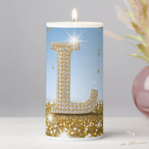 Letter L on Gold Glitter Background With Sparkling Pillar Candle