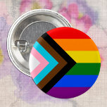 LGBTQ & Pride - Rainbow Progress Flag Button<br><div class="desc">Button: Rainbow Flag & the "Progress" variation adds a chevron along the hoist that features black, brown, light blue, pink, and white stripes to bring those communities (marginalized people of color, trans individuals, and those living with HIV/AIDS and those who have been lost) to the forefront; "the arrow points to...</div>