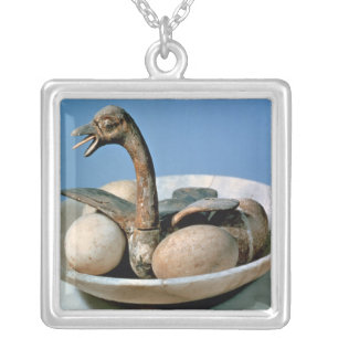 Lid of an alabaster jar decorated with a bird silver plated necklace