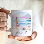 Life is Better at the Beach Personalized Coffee Mug<br><div class="desc">These beautiful personalized coffee mugs features a serene watercolor design of a woman standing by the shoreline, holding a beach hat, with soft shades of pink and blue evoking a serene ocean scene. The words "Life is better at the beach" are elegantly inscribed in trendy script typography. Use the template...</div>