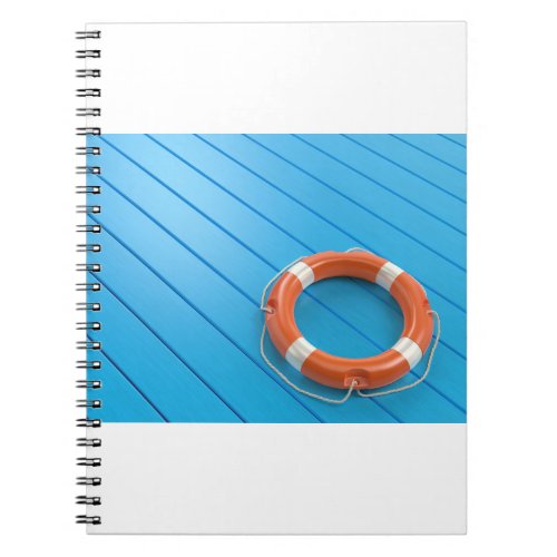 Lifebuoy on blue floor notebook