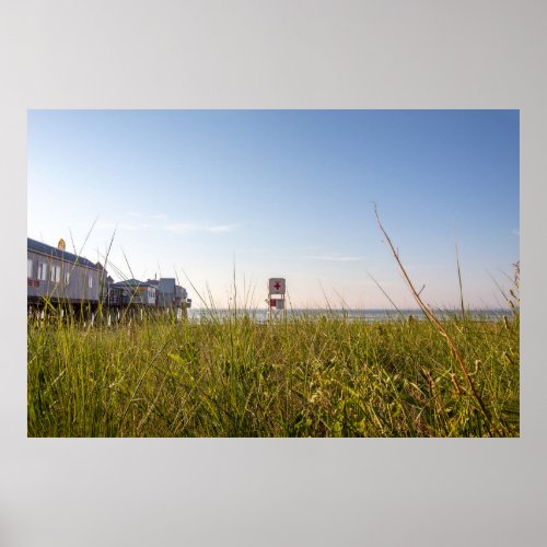 Lifeguard chair seen through the grass poster