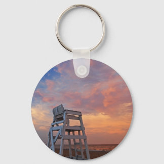 Lifeguard chair with dramatic sky. keychain